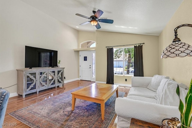 688 Quiet Stream Ct, Henderson, NV 89052 - living area with lofted ceiling, wood finished floors, ceiling fan, and baseboards