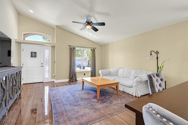 688 Quiet Stream Ct, Henderson, NV 89052 - living room with vaulted ceiling, ceiling fan, wood finished floors, and baseboards