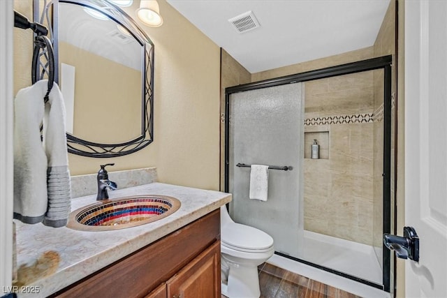 688 Quiet Stream Ct, Henderson, NV 89052 - full bath with a shower stall, toilet, vanity, and wood finished floors