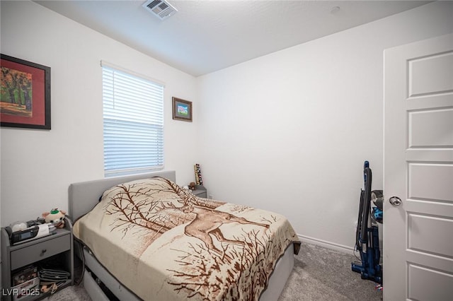 bedroom featuring light colored carpet