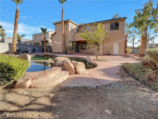 exterior space with a patio and a fenced in pool