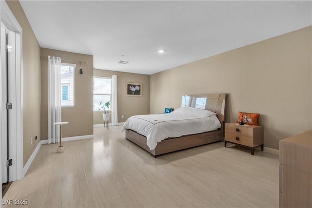 bedroom with light wood-type flooring