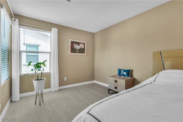 bedroom with light hardwood / wood-style flooring