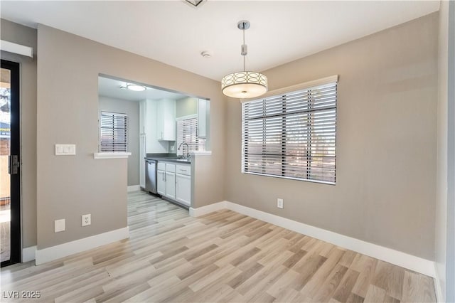 unfurnished dining area featuring light hardwood / wood-style flooring