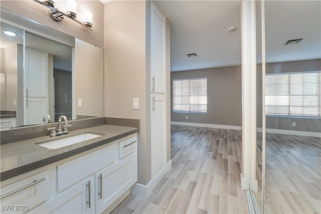 bathroom featuring vanity and wood-type flooring