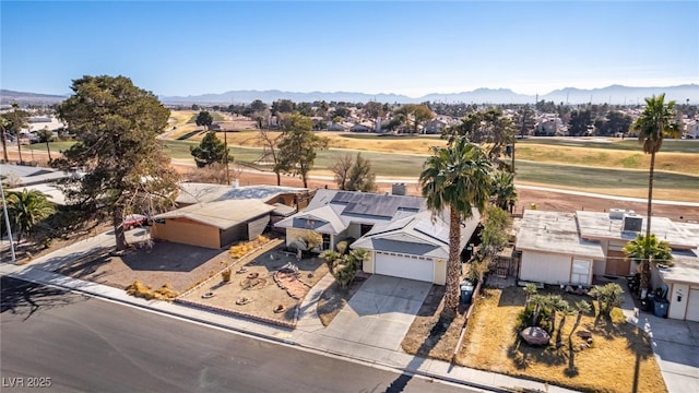 birds eye view of property featuring a mountain view