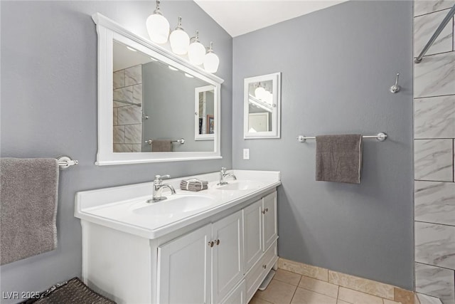 bathroom featuring tile patterned flooring and vanity