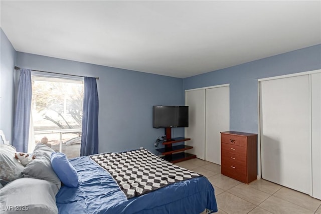 tiled bedroom with two closets