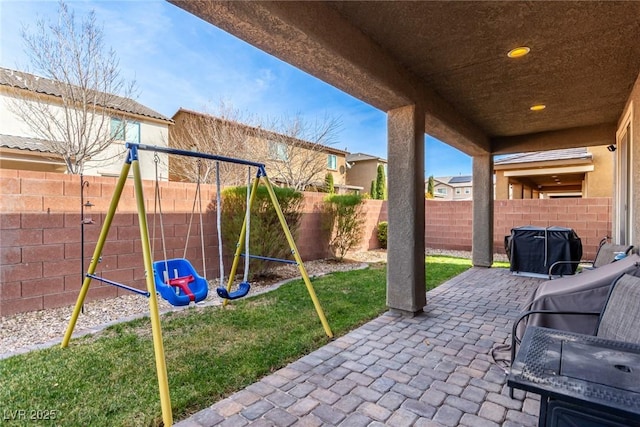 view of patio with a playground