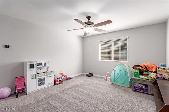 rec room with ceiling fan and carpet floors