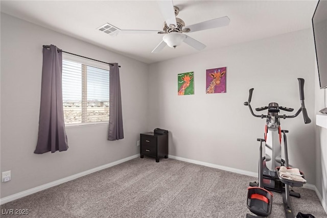 workout area with ceiling fan and carpet flooring