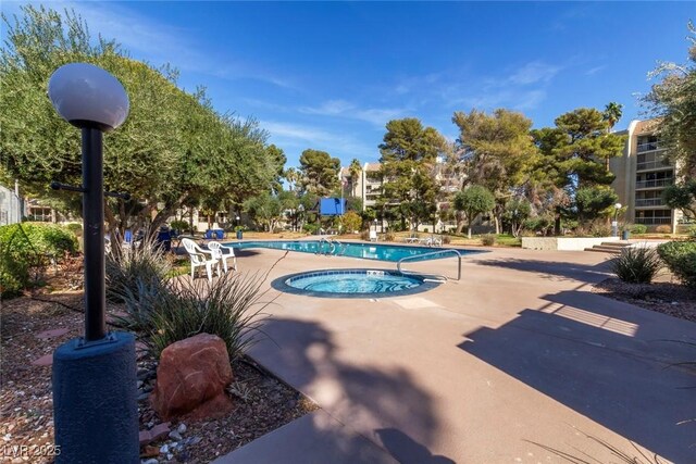 730 S Royal Crest Cir Unit 424, Las Vegas, NV 89169 - community pool with a community hot tub and a patio area