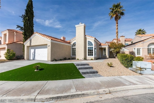 view of front facade featuring a garage and a front yard