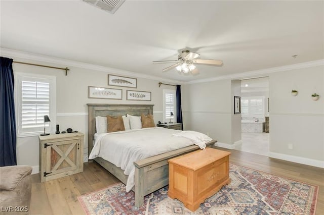 bedroom with light wood-type flooring, ceiling fan, and ornamental molding