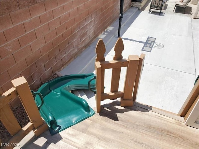 entry to storm shelter featuring a patio area