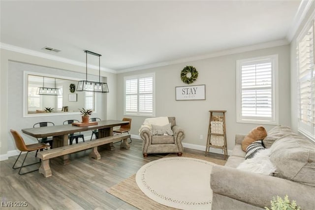 interior space featuring crown molding and wood-type flooring