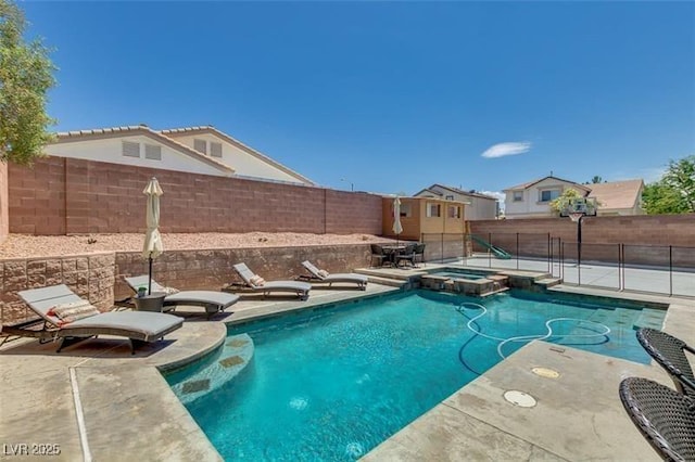 view of pool with a patio and an in ground hot tub