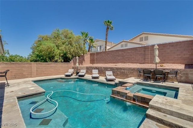 view of pool featuring an in ground hot tub and a patio area