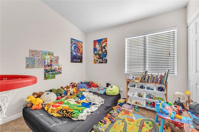 recreation room featuring baseboards and carpet