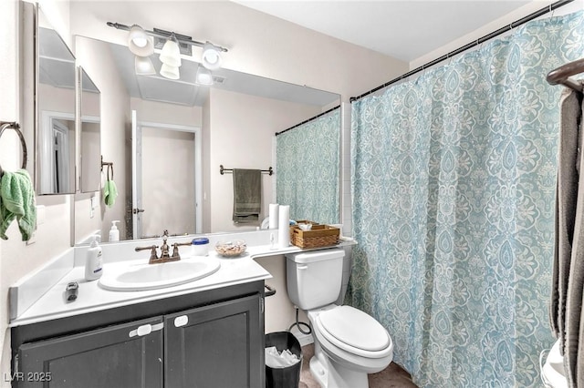 full bathroom with vanity, a shower with shower curtain, and toilet