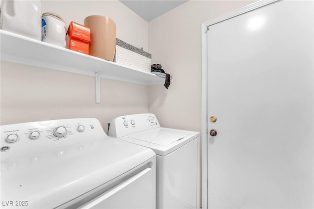 laundry room with laundry area and washing machine and clothes dryer