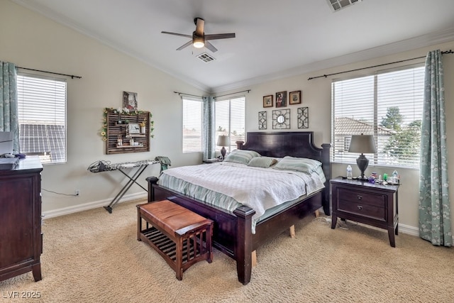 carpeted bedroom featuring vaulted ceiling, ceiling fan, and ornamental molding