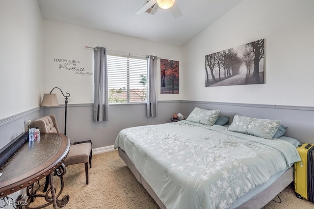 carpeted bedroom featuring vaulted ceiling and ceiling fan