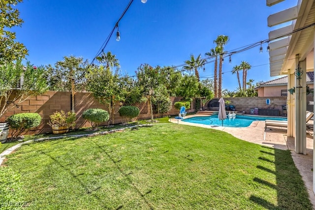 view of yard with a fenced in pool