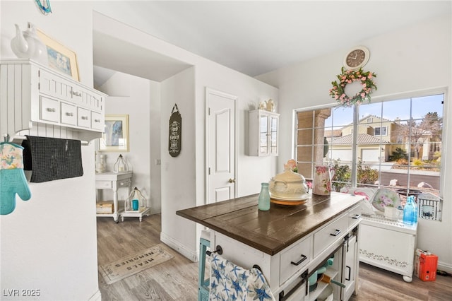 kitchen featuring white cabinetry and light hardwood / wood-style flooring