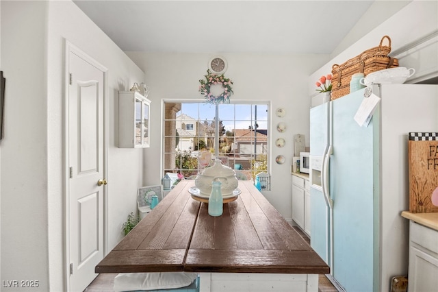 kitchen with white appliances and white cabinets