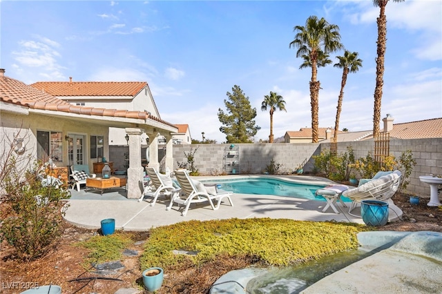 view of pool featuring a patio