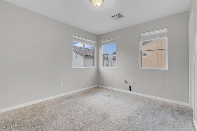 spare room featuring carpet flooring