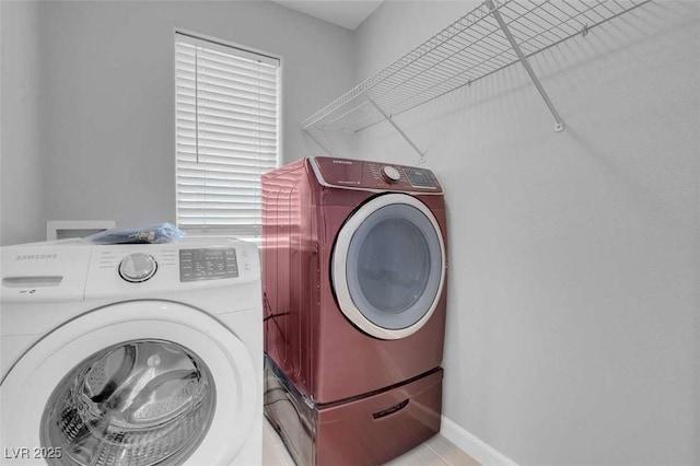 washroom with washer and clothes dryer