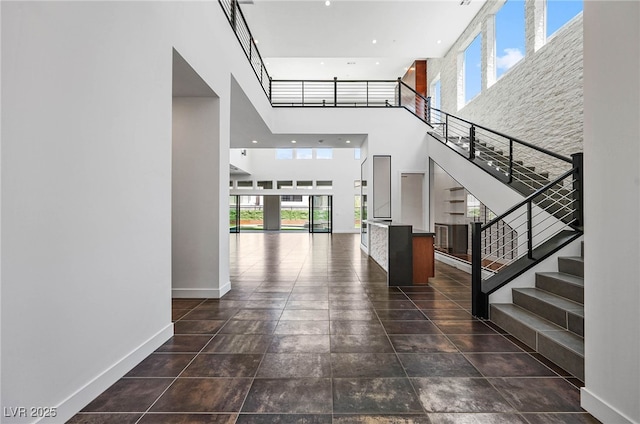 entryway with a towering ceiling