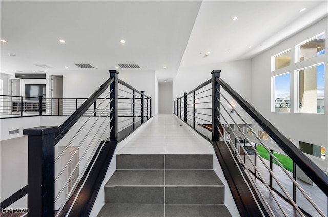 stairs with tile patterned floors