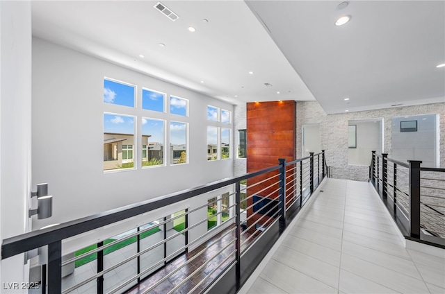 corridor with light tile patterned floors