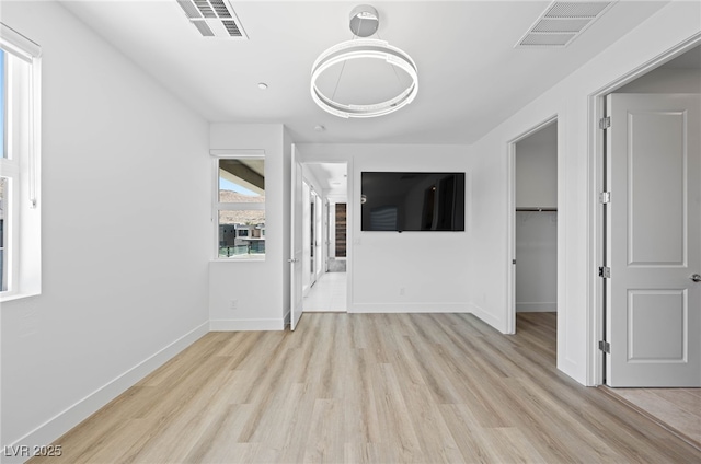 unfurnished living room with light hardwood / wood-style flooring