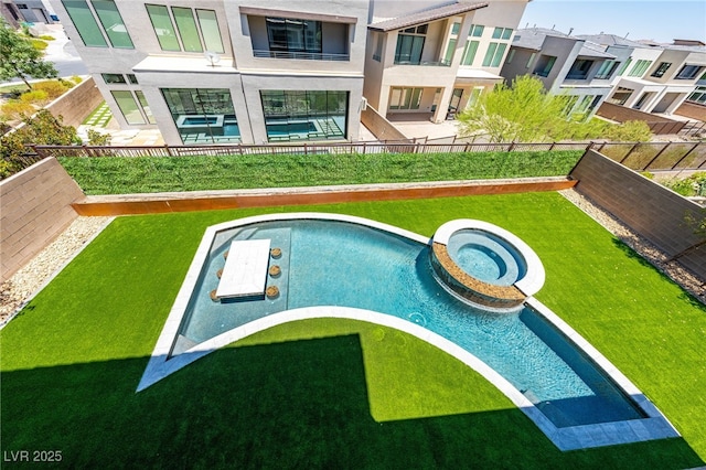 view of pool with a yard and an in ground hot tub