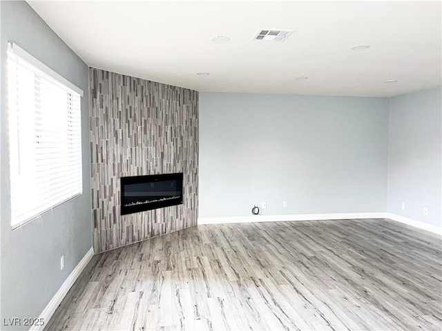 unfurnished living room featuring light wood-type flooring