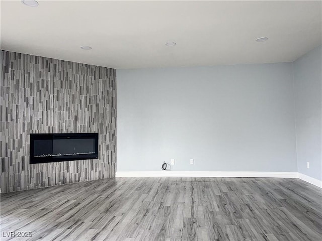 unfurnished living room with light hardwood / wood-style floors