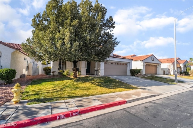 view of front facade with a front lawn and a garage