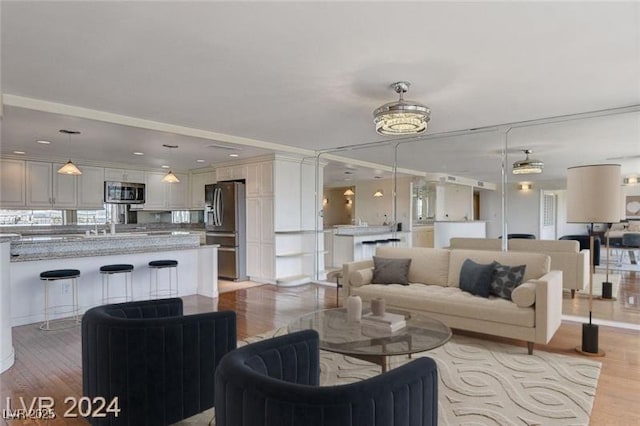 living room with light hardwood / wood-style flooring