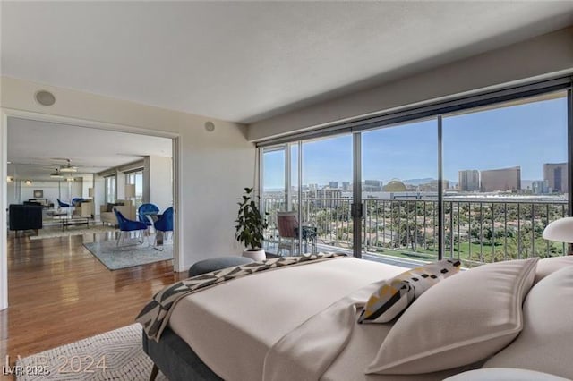 bedroom with hardwood / wood-style flooring