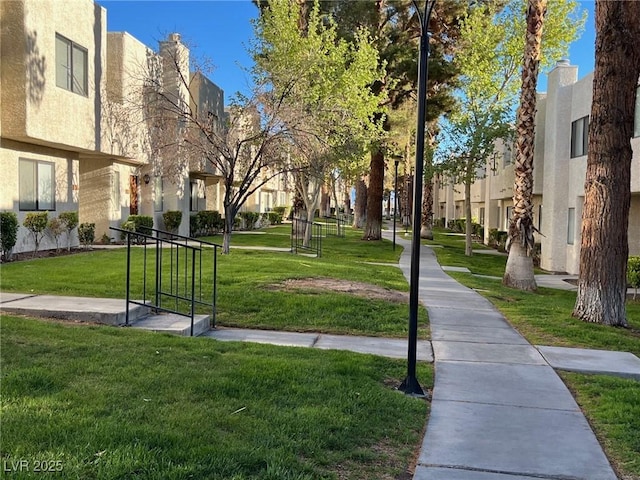 view of home's community featuring a lawn