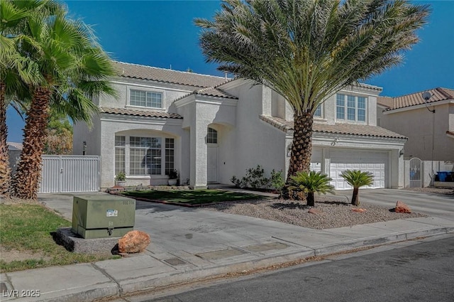 view of front of home featuring stucco siding, concrete driveway, fence, a garage, and a tiled roof