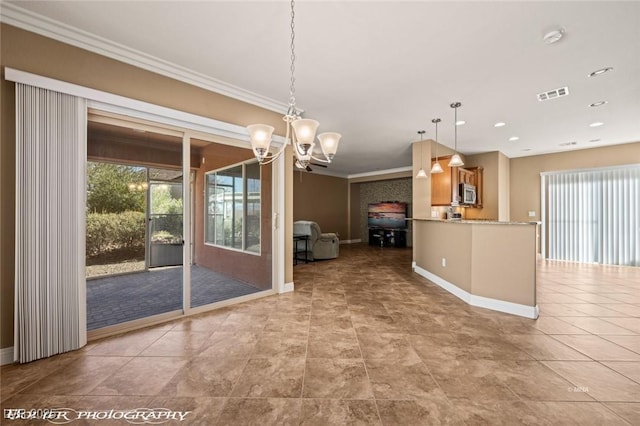 unfurnished dining area featuring ornamental molding, light tile patterned floors, a chandelier, and a wealth of natural light