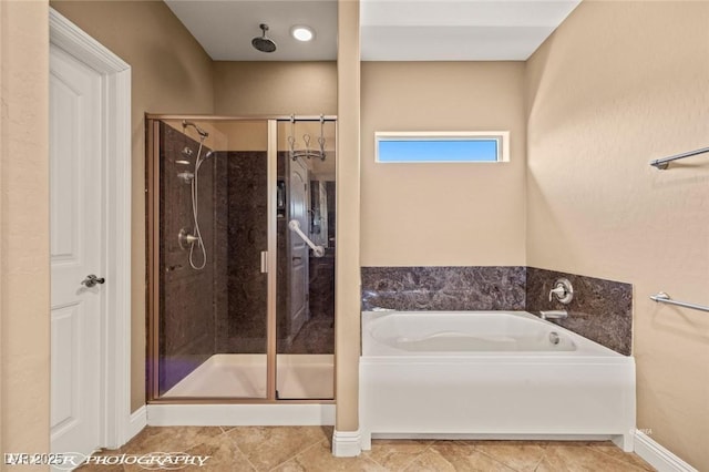 bathroom with tile patterned floors and plus walk in shower