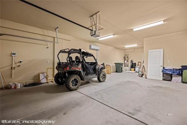 garage with water heater, a wall mounted AC, and a garage door opener