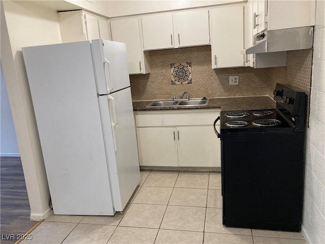 kitchen with white cabinetry, sink, white fridge, light tile patterned floors, and black range with electric cooktop