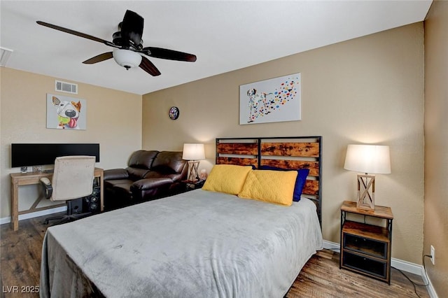 bedroom featuring hardwood / wood-style flooring and ceiling fan